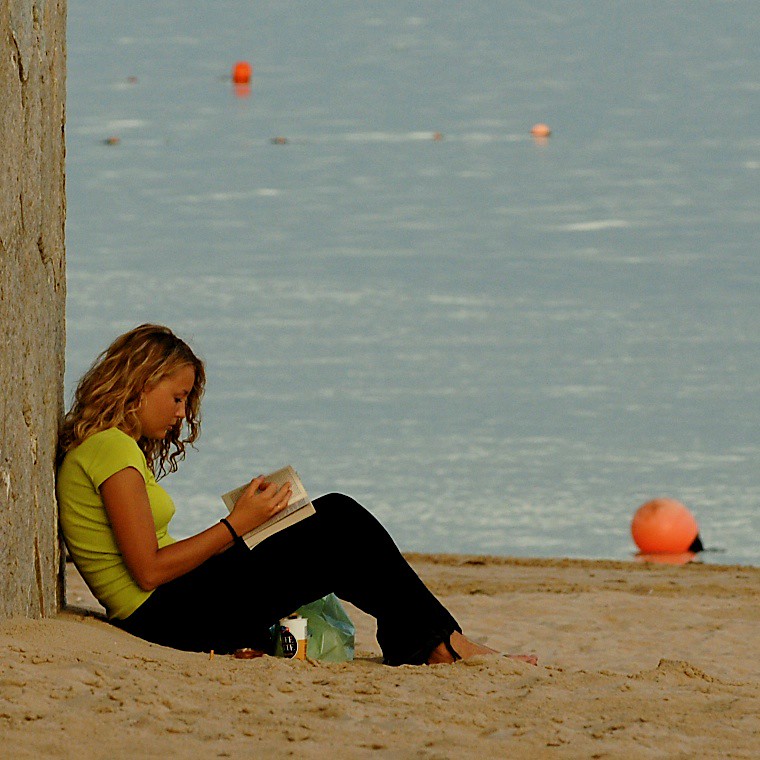 Woman reading on beach